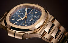 Patek Philippe Nautilus Travel Time Chronograph , 18k Roségold, 40,5 mm